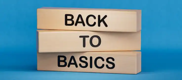 three wooden blocks with Back to Basics one word on each block