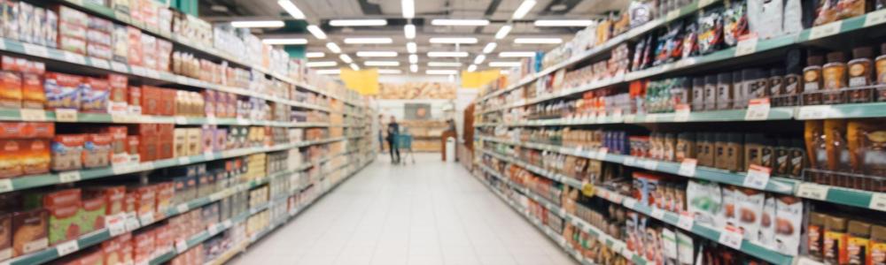 looking down a long aisle in the supermarket